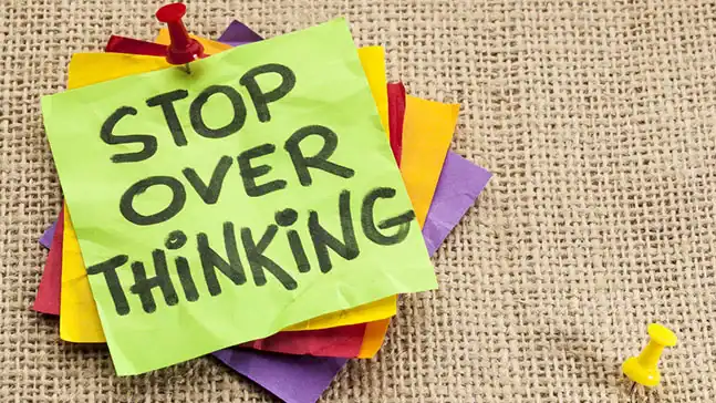 Post-it Notes that say, "Stop Over Thinking"