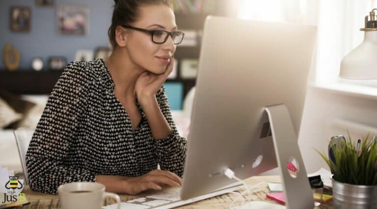 lady sitting at desktop computer looking at the screen