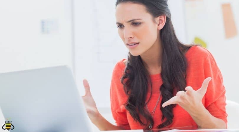 woman frustrated at laptop