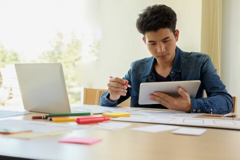 Professional working on a logo design on a tablet