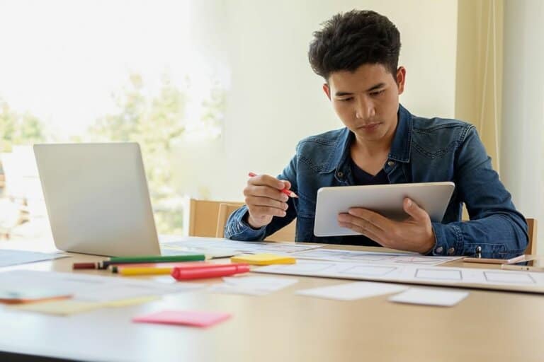 Professional working on a logo design on a tablet