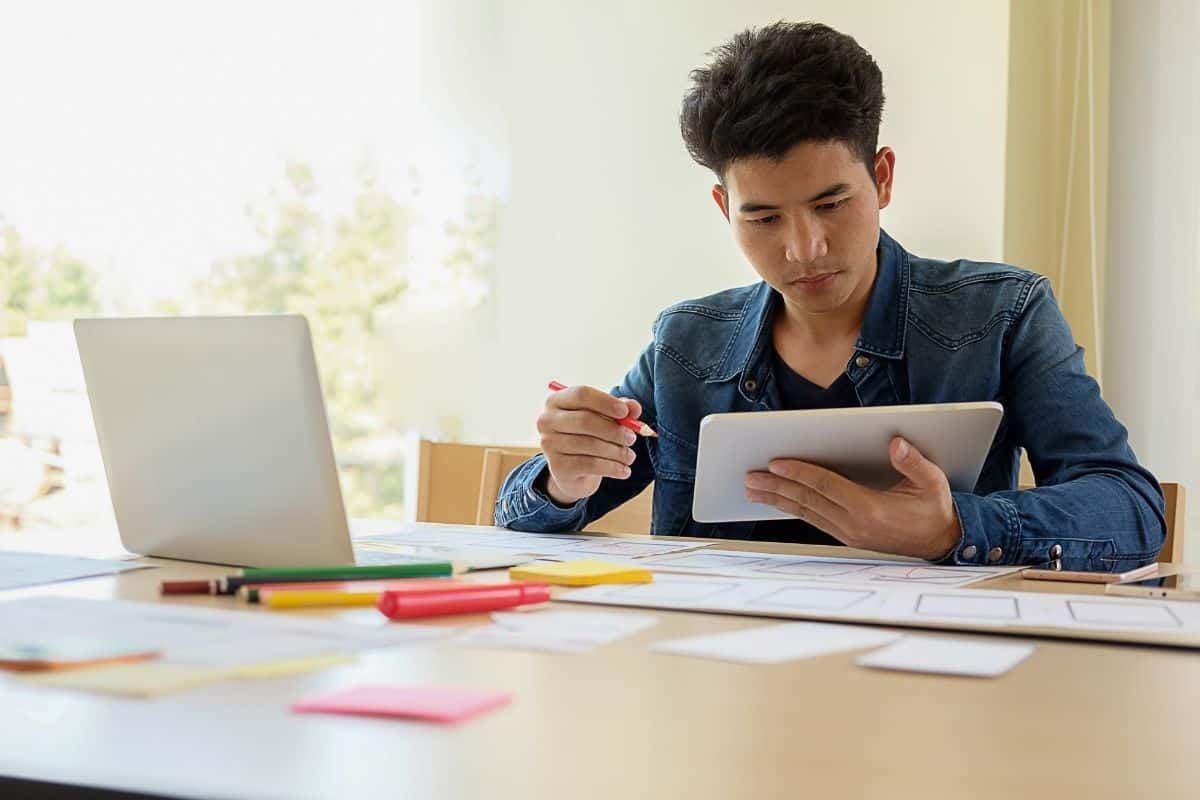 Professional working on a logo design on a tablet