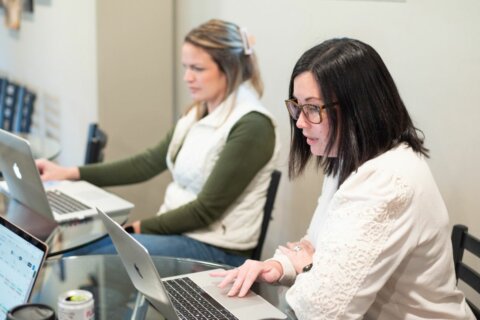 Business owner working on long-term marketing strategy at desk