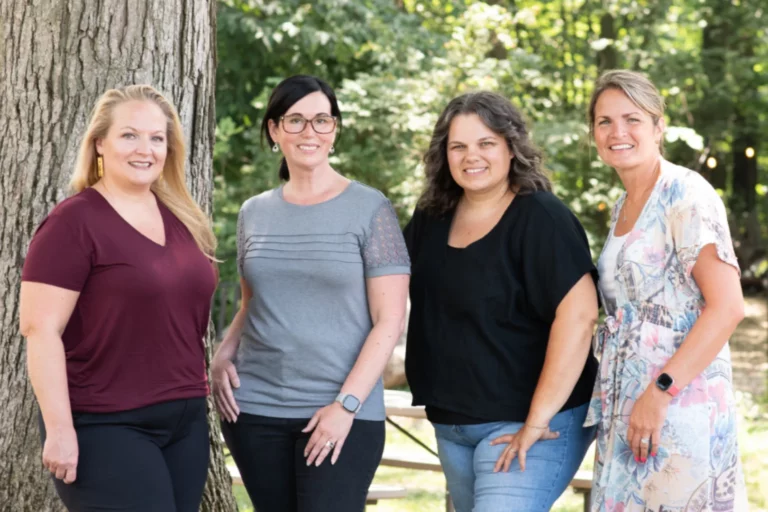 Four women standing together